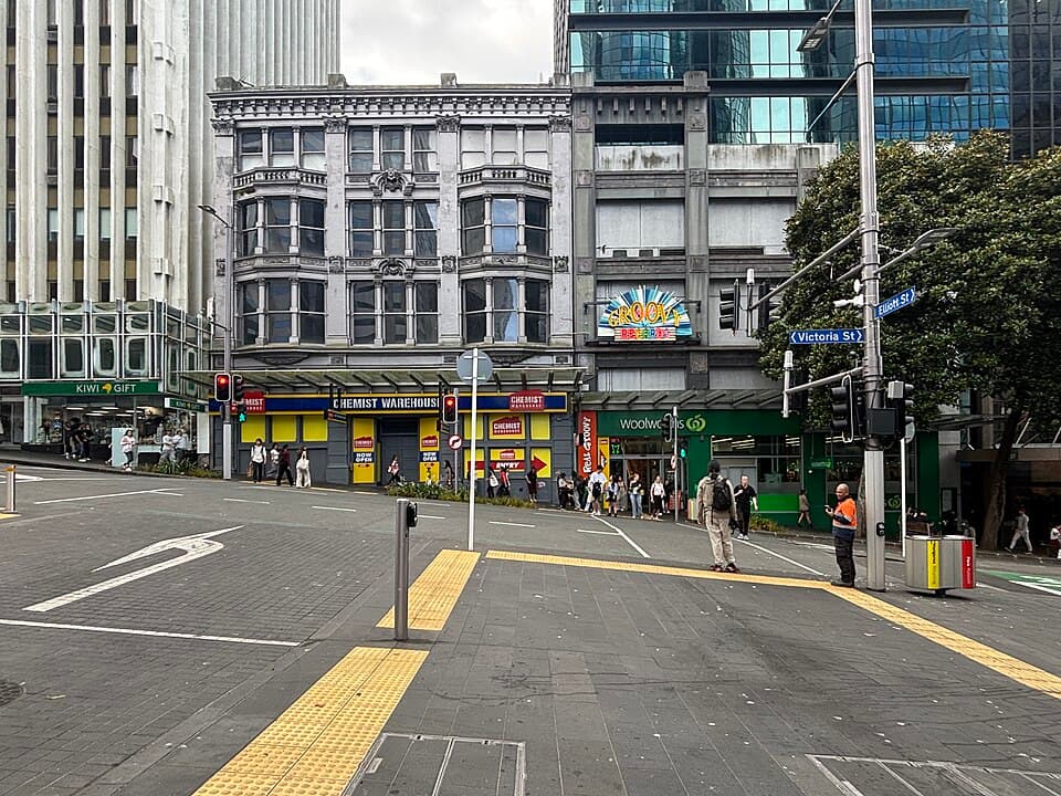 Chemist Warehouse and Woolworths on Victoria Street West, Auckland, seen from Elliott Street, photographed on 10 December 2025